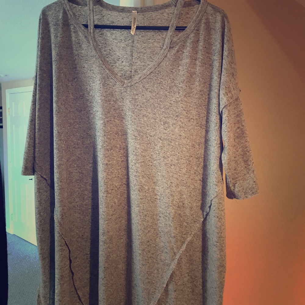 Grey tunic with cutouts at shoulder